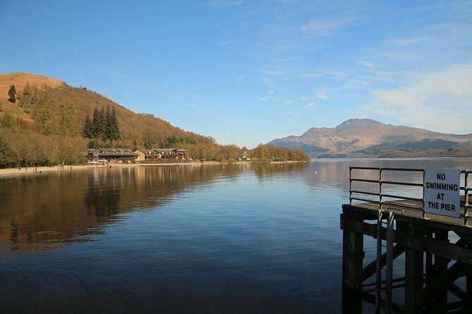 Loch Lomond National Park & Stirling Castle Full Day Tour - Luss on Loch Lomond: cottage rows, a Celtic church, and Viking stonework